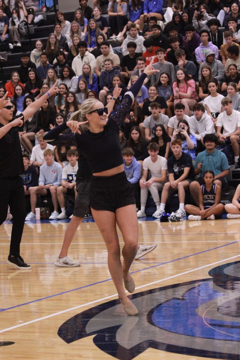 Leah Shilling dancing with the black team  in the student-teacher dance battle