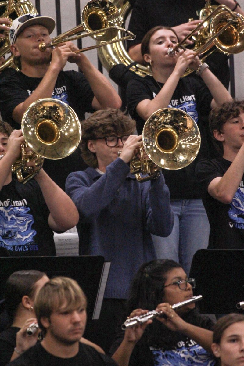 Mason Alexander participating in band for pep assembly