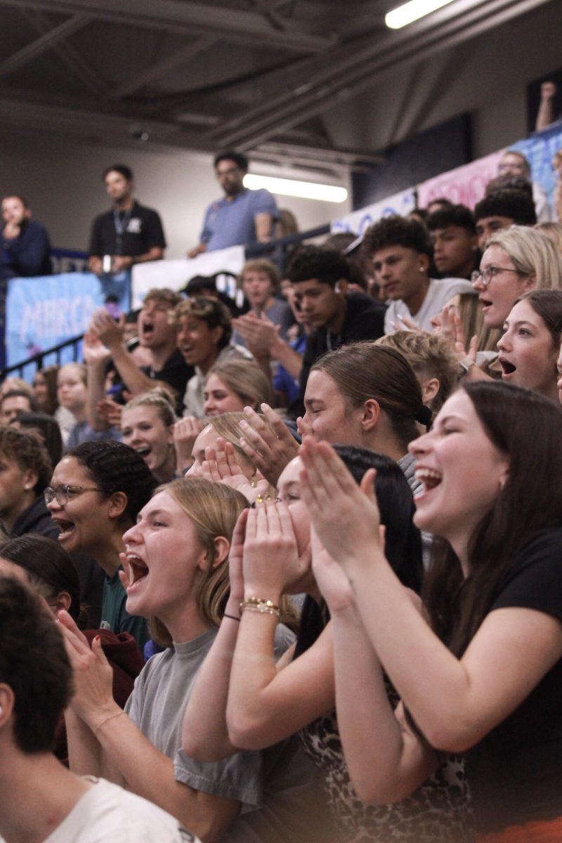 Seniors screaming to will the pep wand for loudest grade.