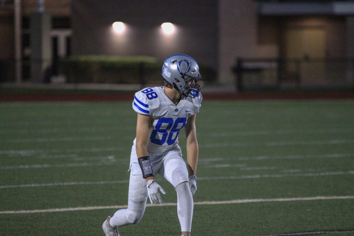 Senior Luke Zimmerman looks toward the line of scrimmage vs Shawnee Mission North