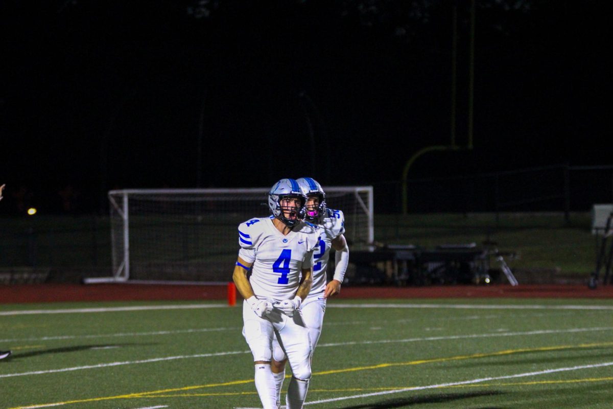 Senior Justice McAdoo celebrates after a blocked punt against Shawnee Mission North