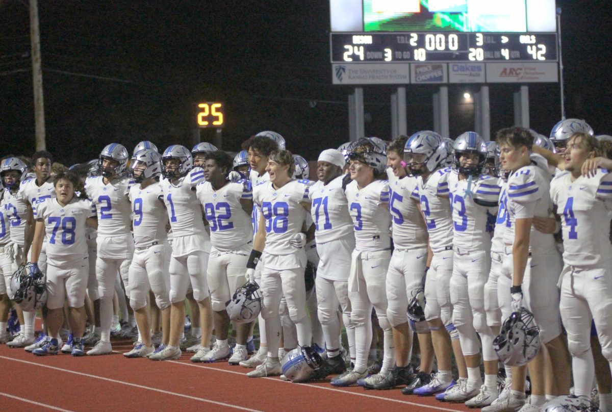 Owls sing the Alma Mater after a win against Shawnee Mission North