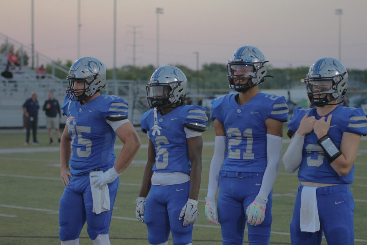 Mason Scheider (75), Terrence Folarin (6), Brody Butler (21), and Brody Hale (3) look menacingly at the Blazer'scaptains