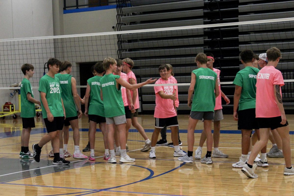 The senior and sophomore team shake hands after a match.