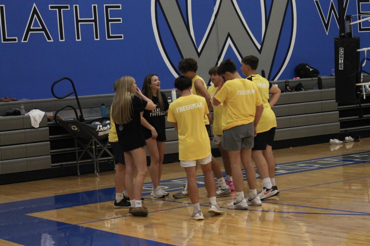 Freshman team huddle during a time out.