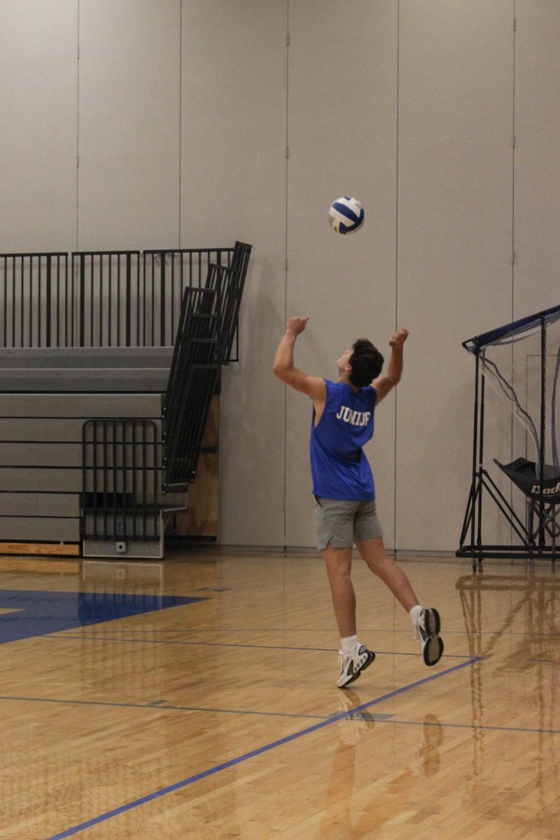 Junior team serves the ball.