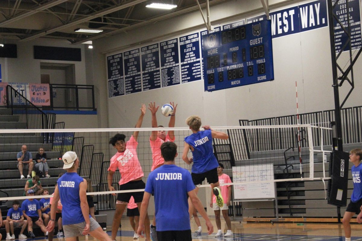 Logan Karsten blocks a hit from the junior team.