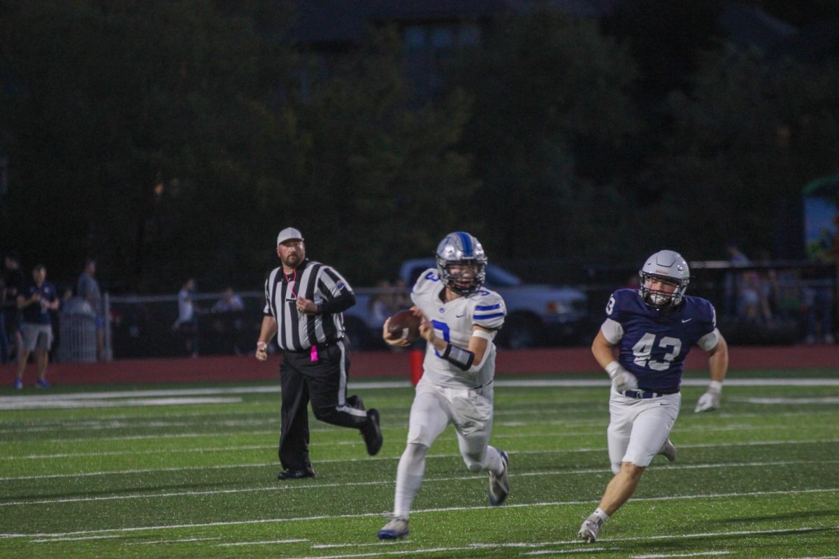 Senior Brody Hale scrambles out of the pocket against Mill Valley