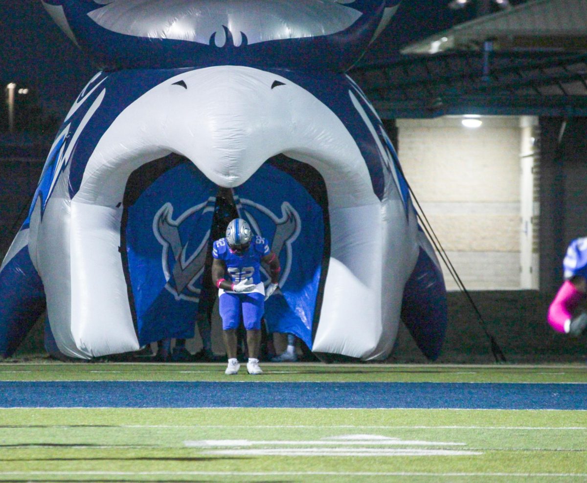 Senior Jalen Johnson bows during pregame introductions before the game against Shawnee Mission East