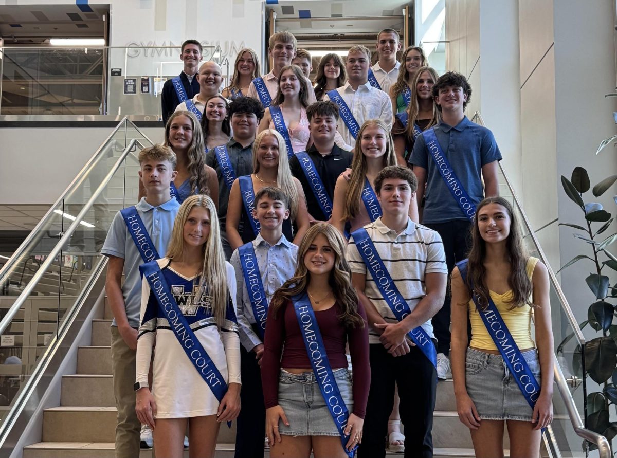 Homecoming court candidates line the stairs for a photo. 