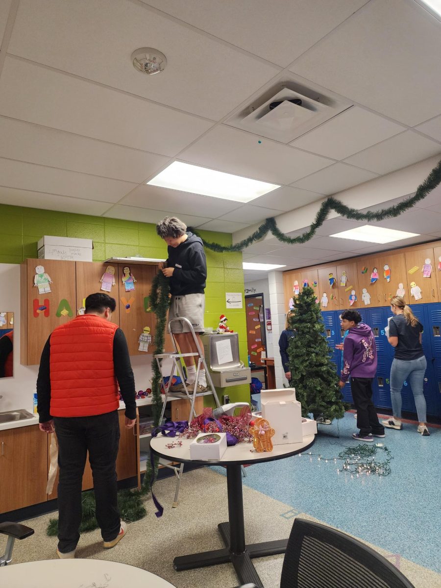 Photo taken in Black Bob Elementary of students decorating for Christmas.