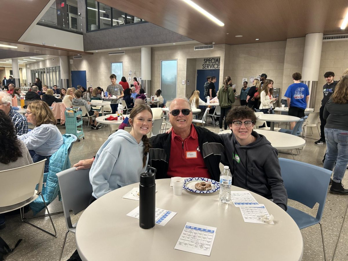 Junior Peyton Richerson and freshman Easton Richerson with their grandpa at Give-a-Hoot.