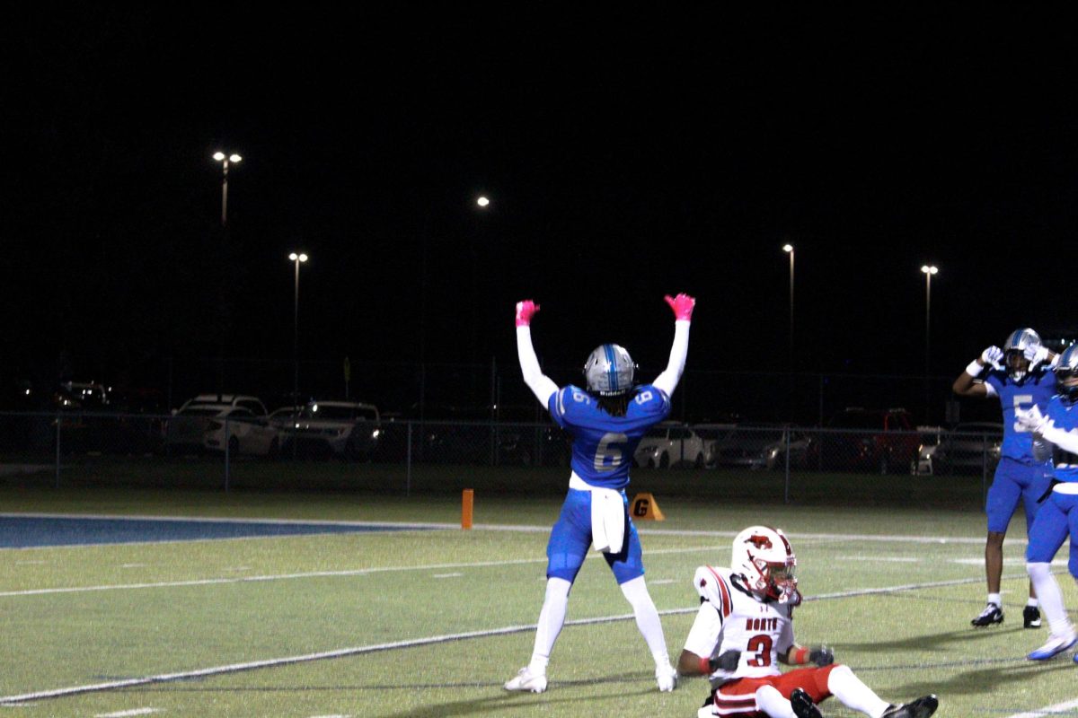 Senior Terrence Folarin celebrates after a pass breakup 