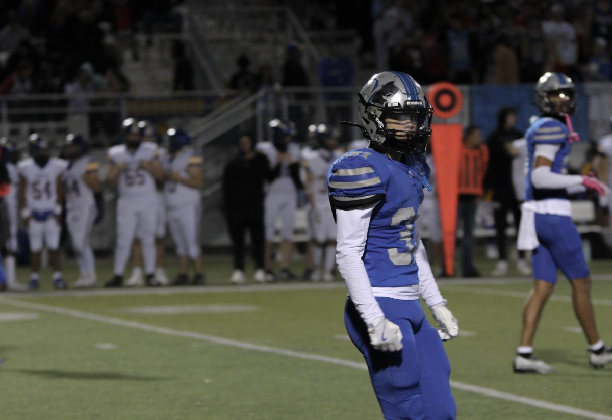 Junior Tanner Buster looks to the sideline against Olathe South